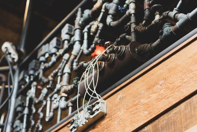 High angle view of piano keys on wooden floor