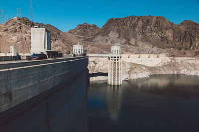 View of dam on mountain against sky