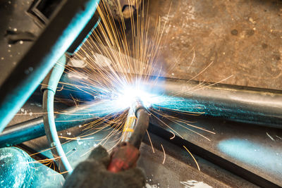 Close-up of man welding metal