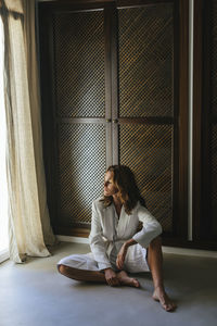 Woman sitting on floor