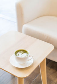 High angle view of coffee cup on table