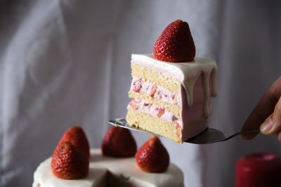 Close-up of hand holding ice cream