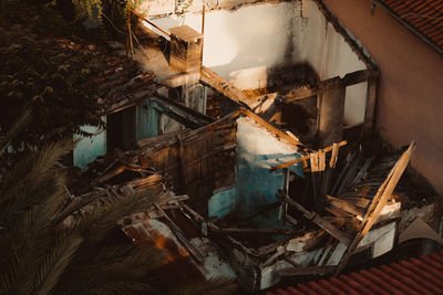 Abandoned building seen through broken window