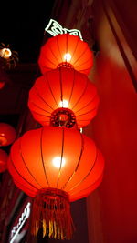 Low angle view of illuminated lanterns hanging on ceiling