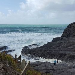 Scenic view of sea against cloudy sky