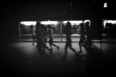 Woman standing at night