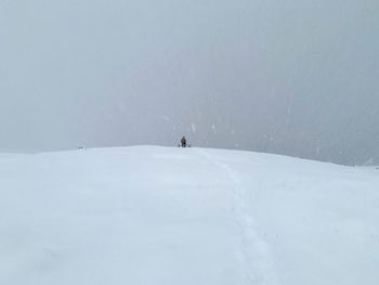 Person skiing on snowcapped mountain