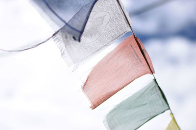 Close-up of flags against sky