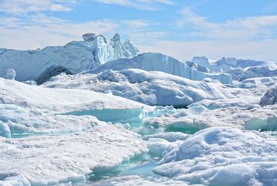 Scenic view of frozen lake against sky