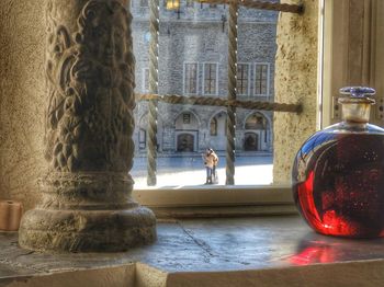 People by sculpture outside building