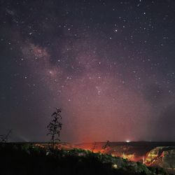 Scenic view of star field against sky at night