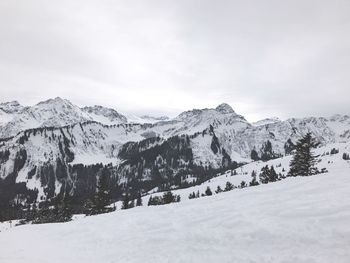 Scenic view of snowcapped mountains against sky
