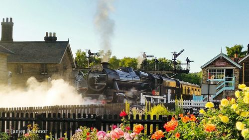 Smoke emitting from chimney against buildings in city