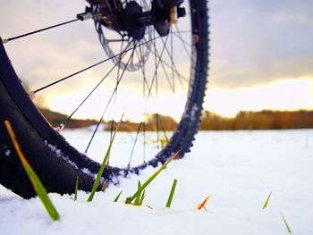 Close-up of bicycle wheel during winter