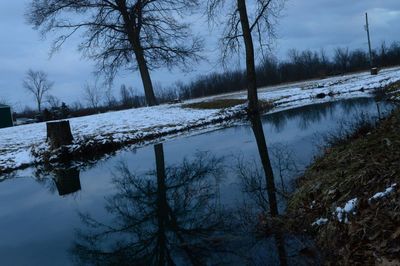 Scenic view of frozen lake against sky during winter
