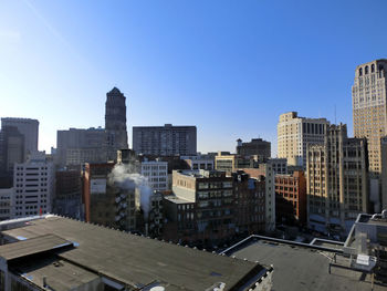 Cityscape against clear sky