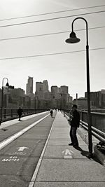 Woman walking on road