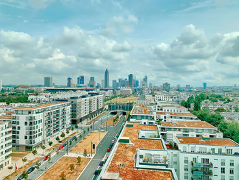 High angle view of buildings in city against sky