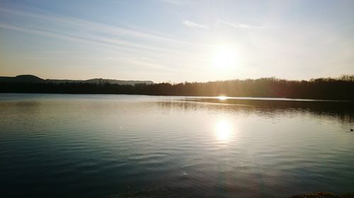 Scenic view of lake at sunset