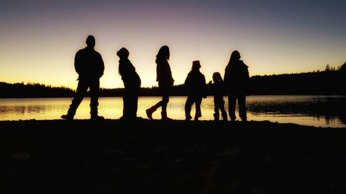 Silhouette of people at sunset
