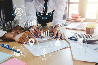 Midsection of man having food on table