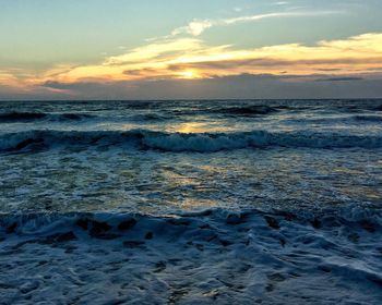 Scenic view of sea at sunset