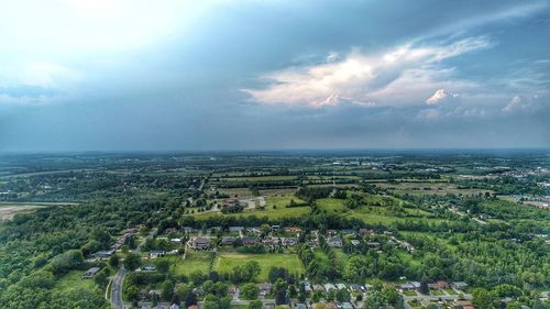 High angle view of trees and buildings against sky