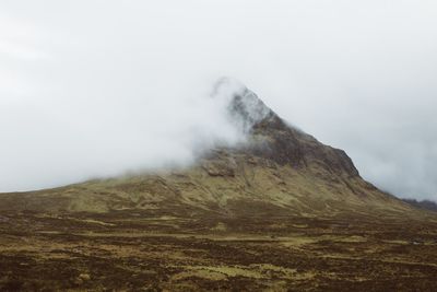 Scenic view of volcanic mountain against sky