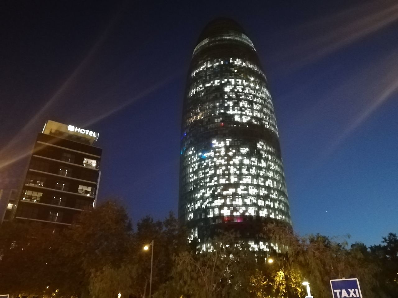 LOW ANGLE VIEW OF ILLUMINATED BUILDINGS AGAINST SKY