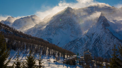 Panoramic view of snowcapped mountains against sky