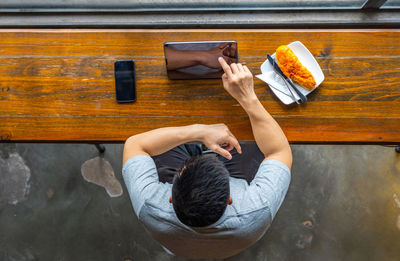 High angle view of woman sitting on table