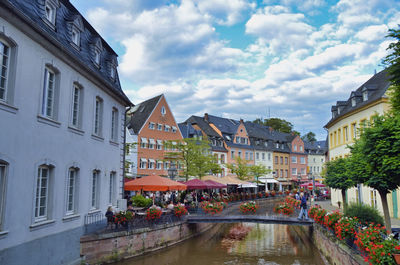 Buildings in town against sky