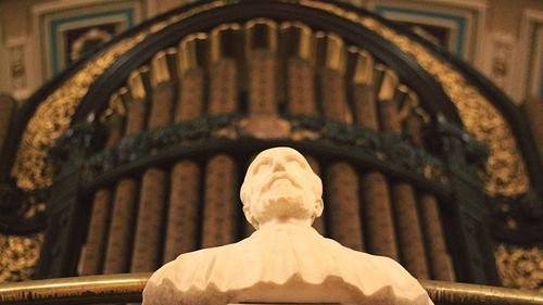 Low angle view of statue against building