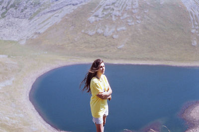 Full length of woman standing in water