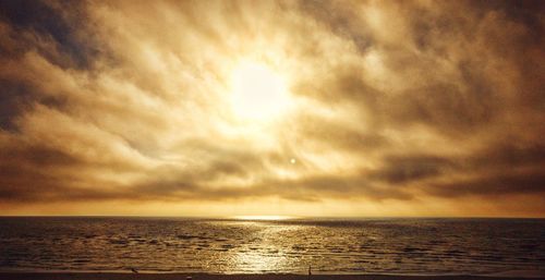 Scenic view of sea against sky at sunset