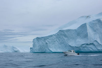 Scenic view of iceberg against sky