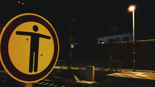 Illuminated information sign at night