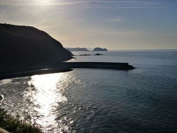 Scenic view of sea against sky at sunset