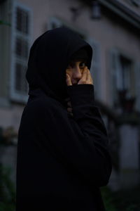 Portrait of woman standing outdoors