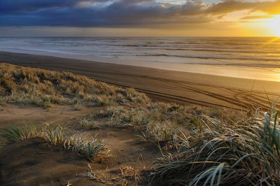 Scenic view of sea against sky during sunset