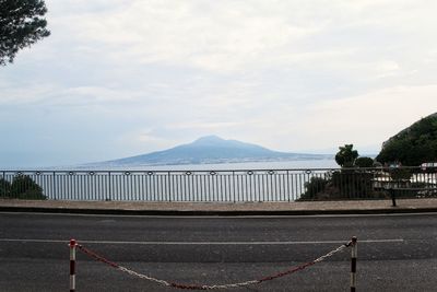 Scenic view of bridge over mountains against sky