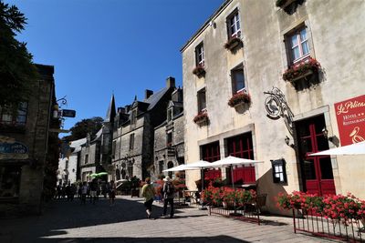 Street amidst buildings in town against sky