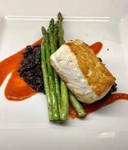 High angle view of fish served in plate on table