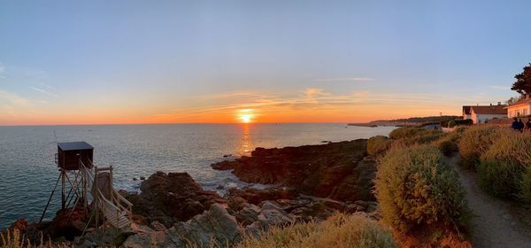 Scenic view of sea against sky during sunset