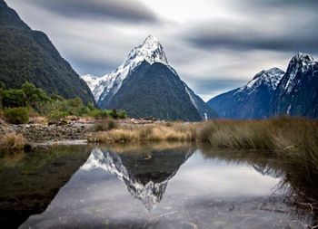 Scenic view of lake with mountains in background