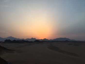 Scenic view of mountains against sky during sunset