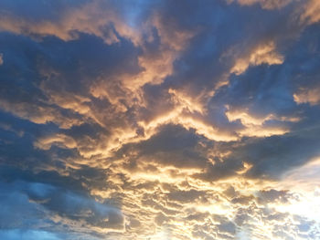 Low angle view of dramatic sky during sunset