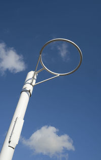 Low angle view of pole against blue sky