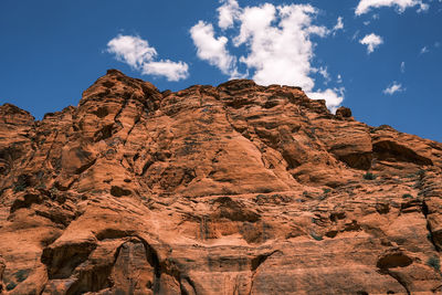 Low angle view of rock formation against sky