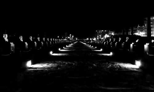 Illuminated lights in water at night